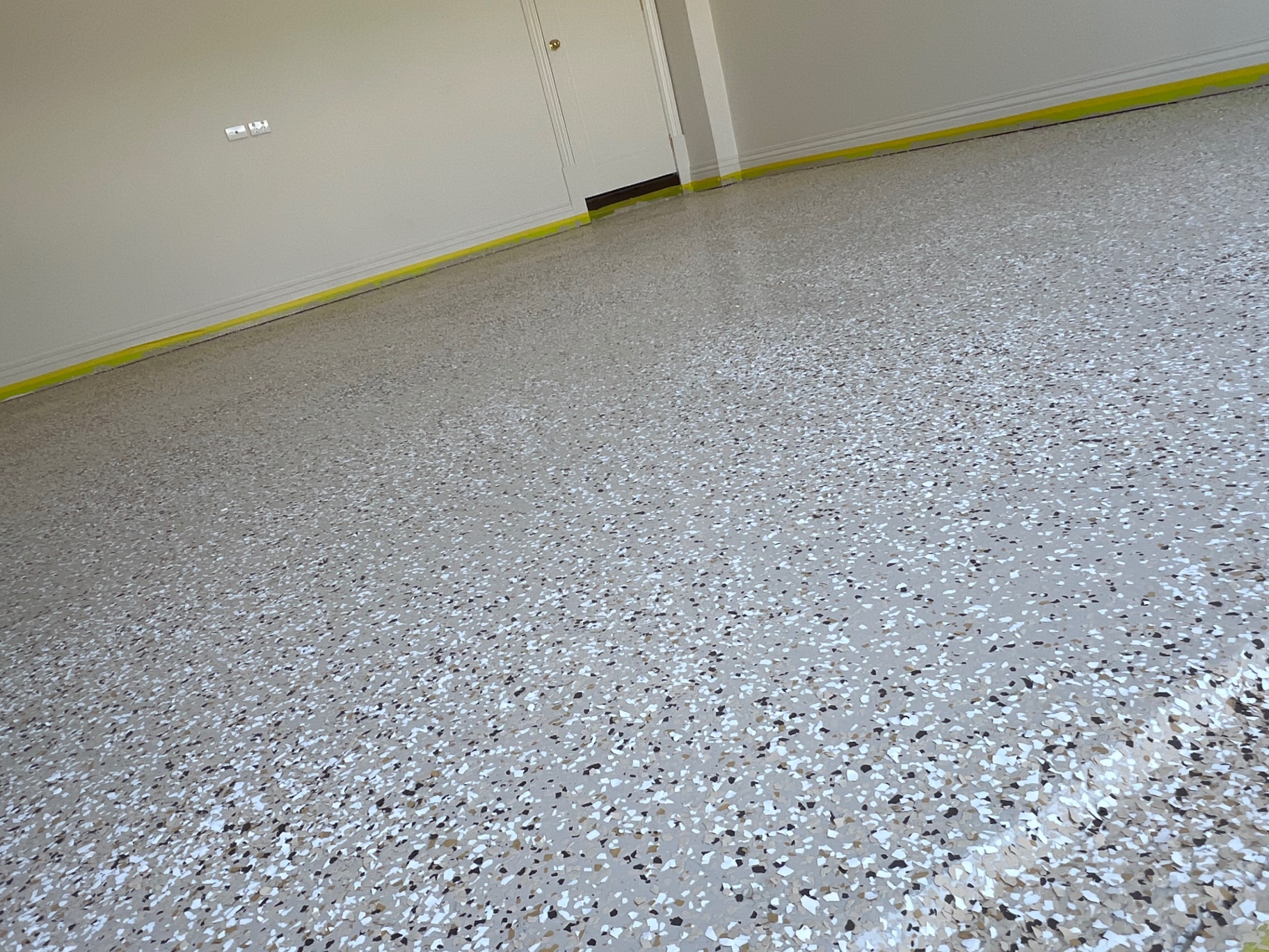 Garage floor before and after epoxy flake